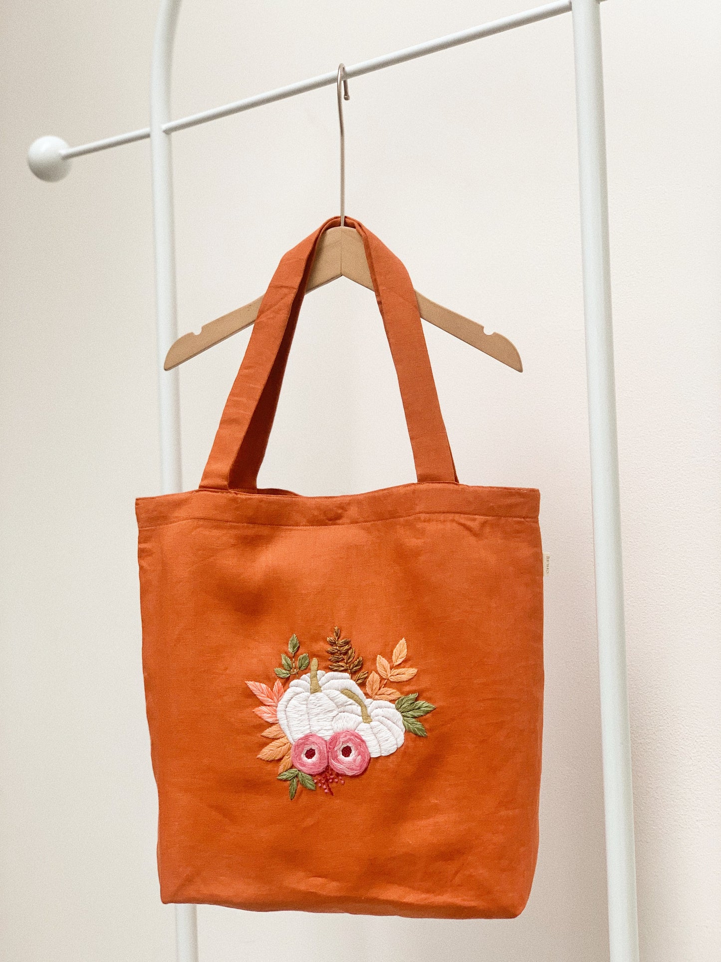 Hand embroidered linen tote bag with pumpkin design