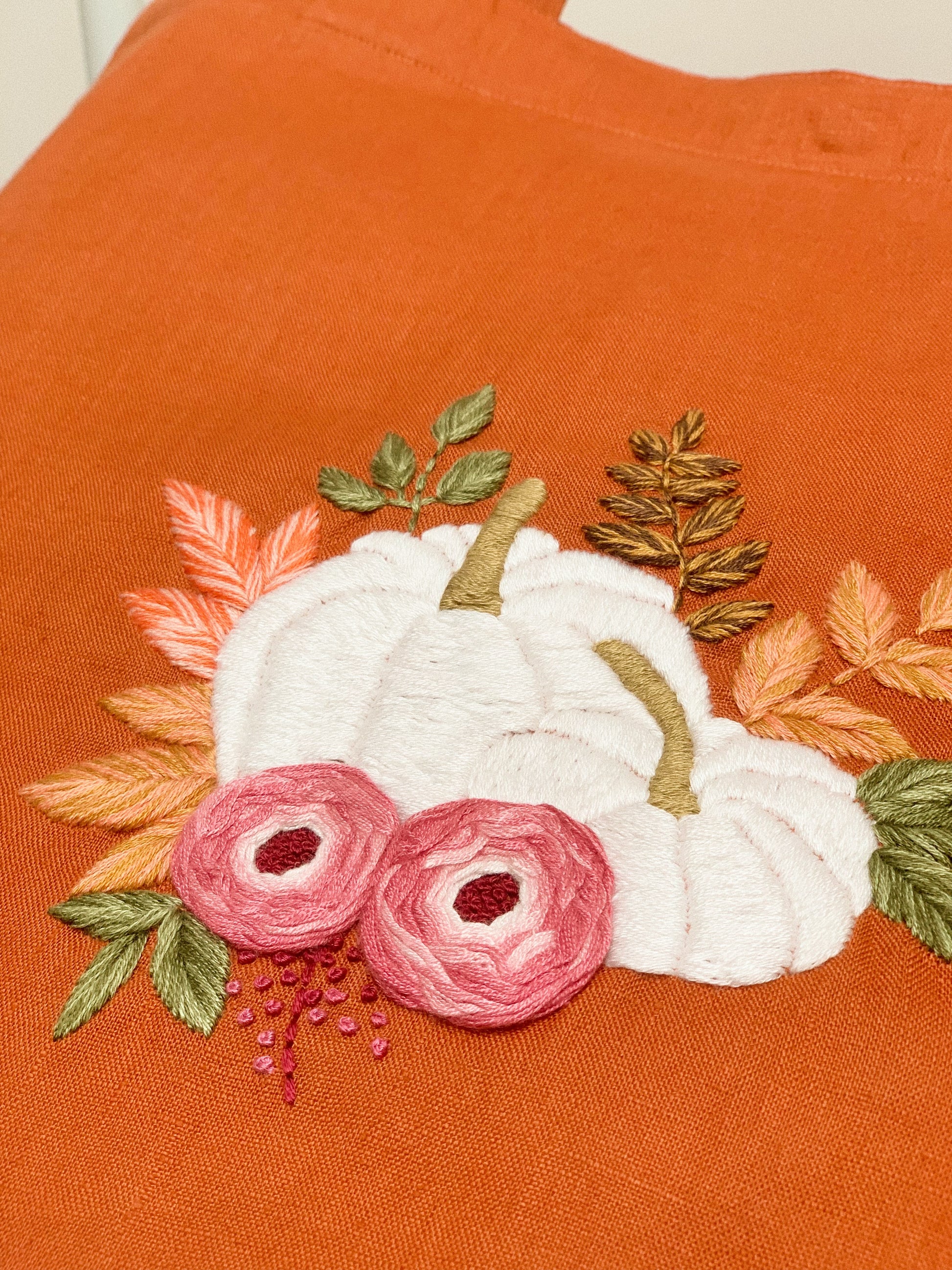 Hand embroidered linen tote bag with pumpkin design