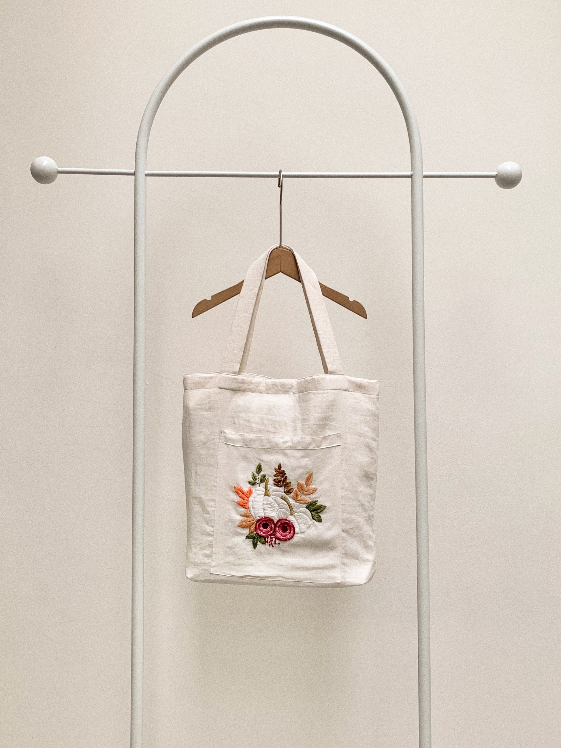 Hand embroidered linen tote bag with pumpkin design