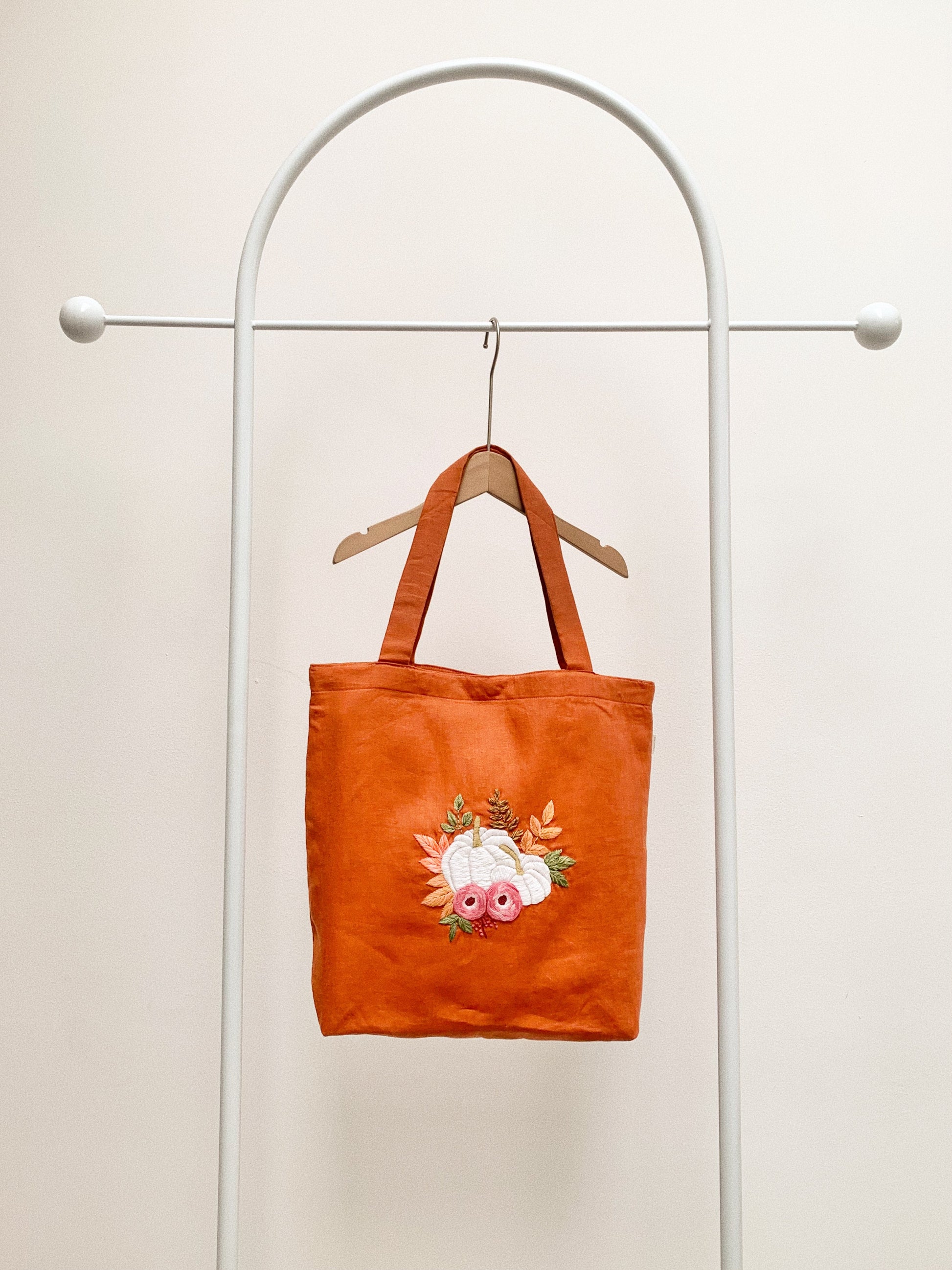 Hand embroidered linen tote bag with pumpkin design