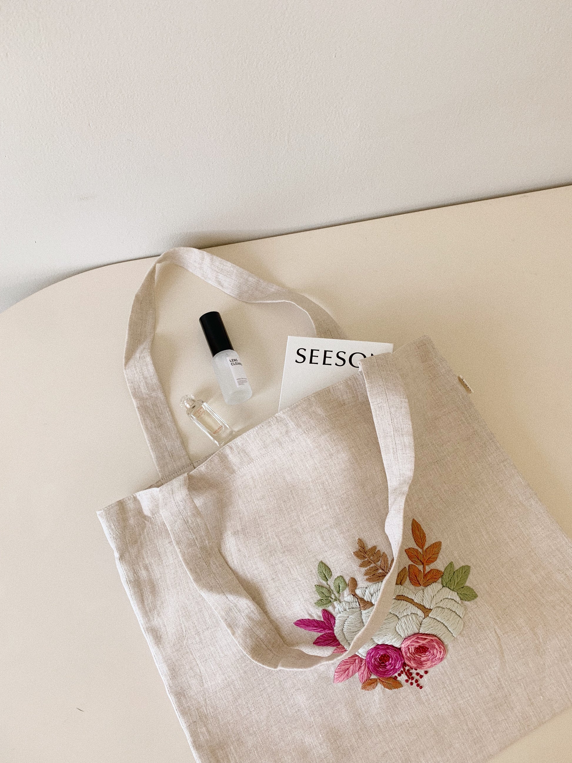 Hand embroidered linen tote bag with pumpkin design
