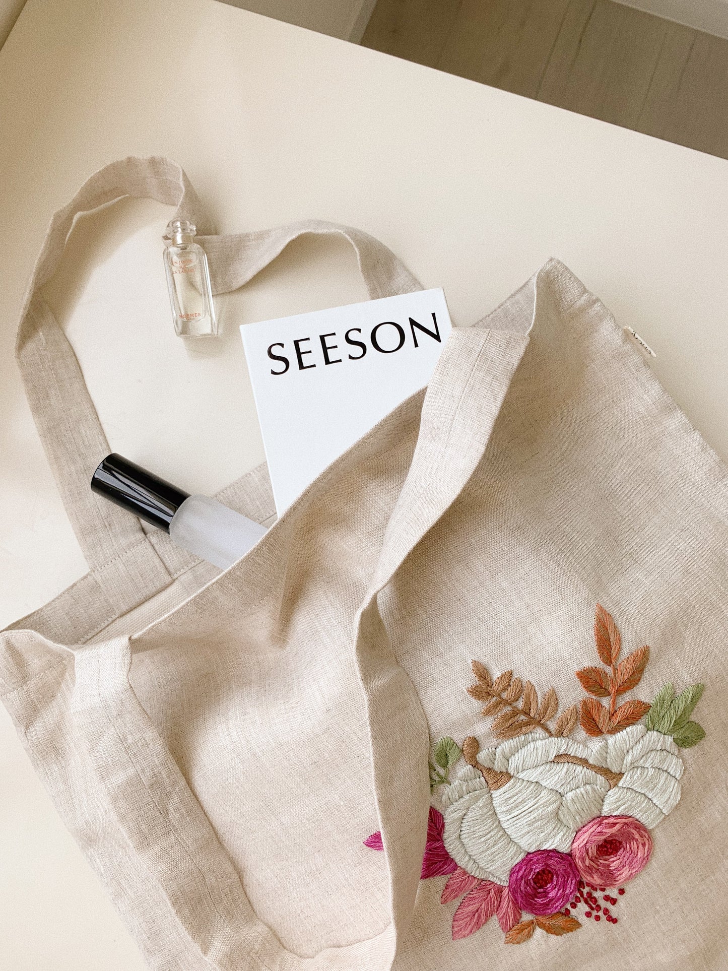 Hand embroidered linen tote bag with pumpkin design