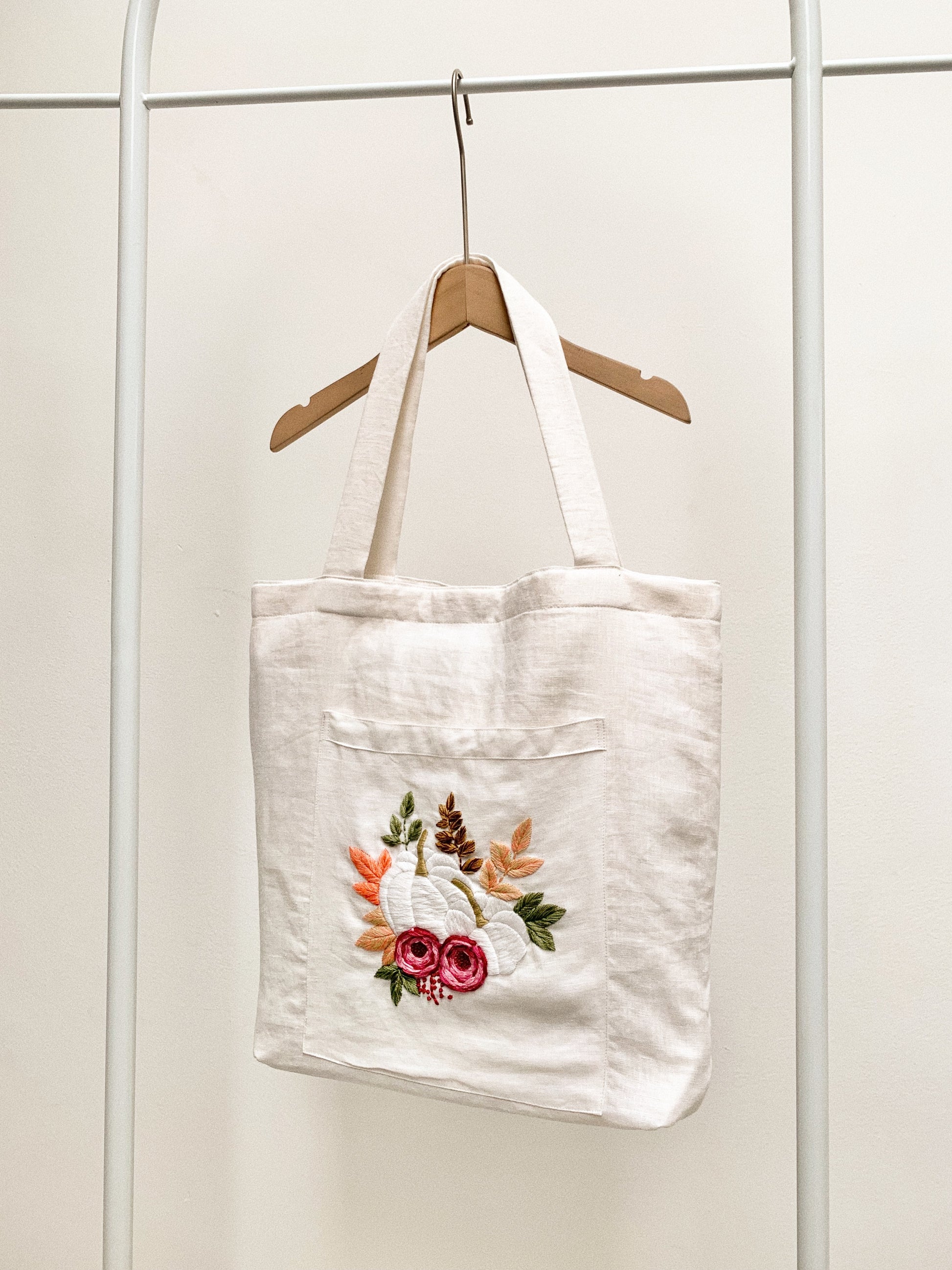 Hand embroidered linen tote bag with pumpkin design